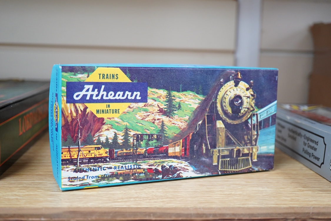 A quantity of US outline HO railway by Athearn, Bachmann, etc. including three locomotives; a Union Pacific Bo-Bo diesel, 1468, a Santa Fe Bo-Bo diesel, 5707, and a Santa Fe 0-4-0 tender engine, together with a 12-wheel